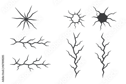 Vector set of ground cracks and broken glass holes. Surface damage effect from earthquake or impact. Destroyed wall texture illustration. Black line art design elements.