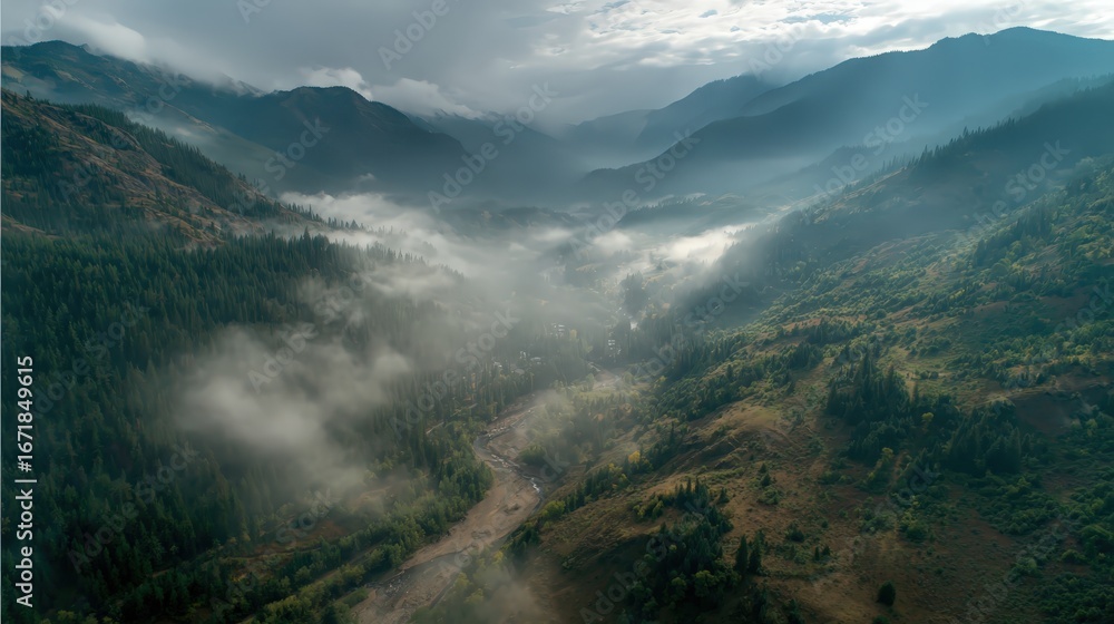 Obraz premium drone shot of mountain valley, morning mist 