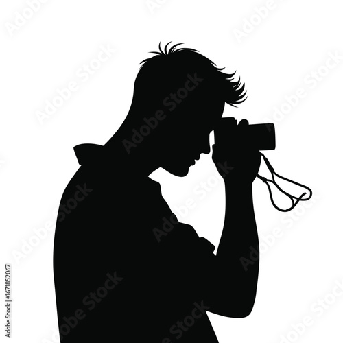 Black silhouette of a man holding a camera photography