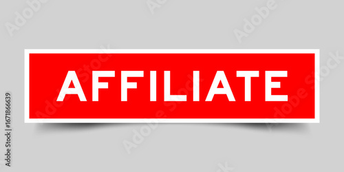 Red color square shape sticker label with word affilate on gray background