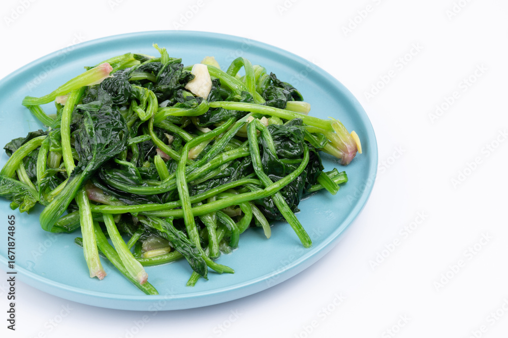 The stir-fried spinach with vegetables on the plate The stir-fried spinach with vegetables on the plate
