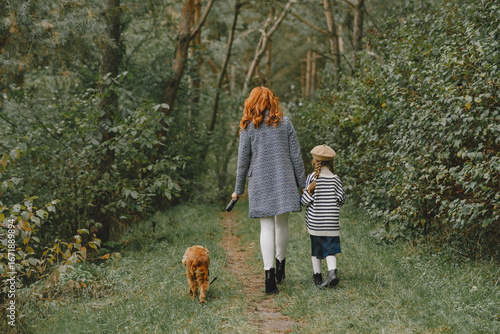 Happy family having fun in autumn forest