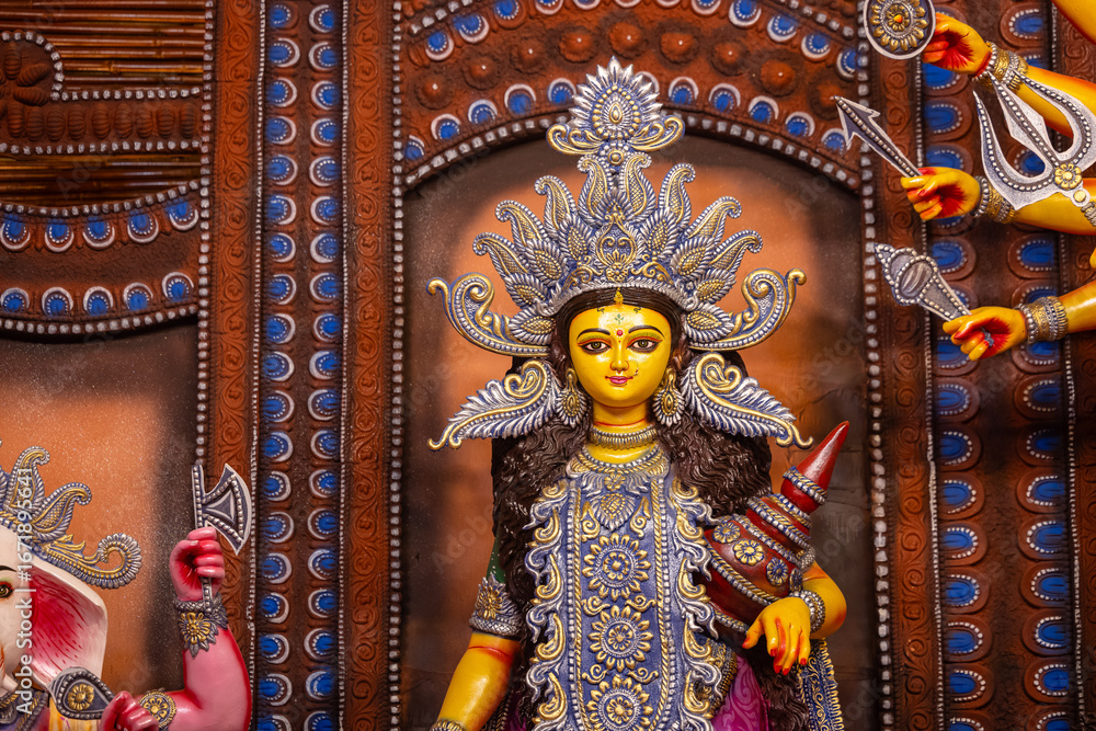 Obraz premium Subho mahalaya, An handmade idol of Goddess Durga decorated in colorful Pandal. 