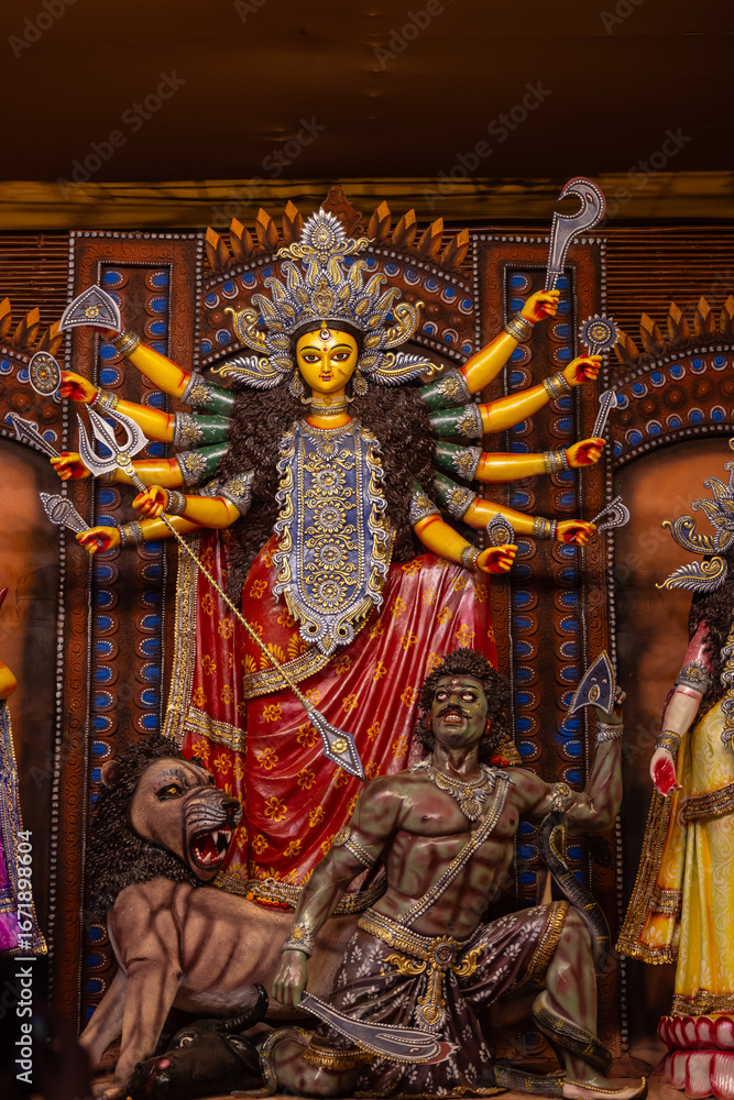 Fototapeta premium Subho mahalaya, An handmade idol of Goddess Durga decorated in colorful Pandal. Durga Puja is biggest religious festival of Hinduism and for bengalis and is now celebrated worldwide.