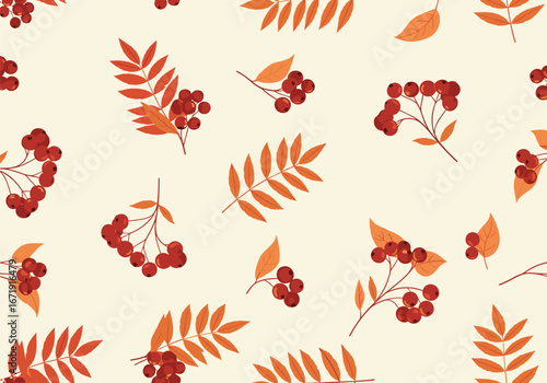 Beautiful pattern of autumn rowan berries and leaves on light background