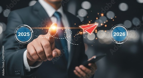 Businessman pointing at a red paper airplane flying between 2025 and 2026