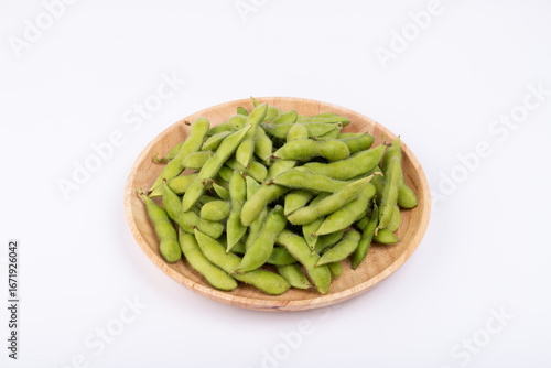 Fresh edamame in a wooden plate