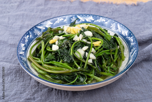 The stir-fried sweet potato leaves on the plate