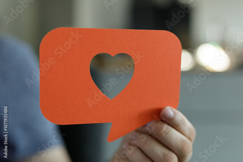 Person holding an orange sp...
