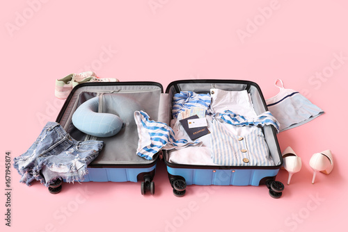 Open suitcase with female c...