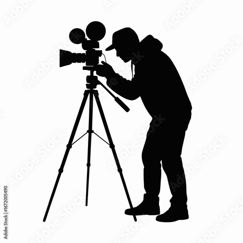 Silhouette of a Cameraman with Tripod Setup