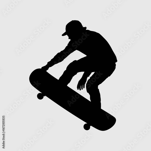 Skateboarder Performing Trick in Silhouette