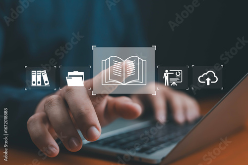 Digital learning and knowledge management concept with open book icon, cloud storage, education, courses files, and education technology interface on laptop screen for e-learning and online study.