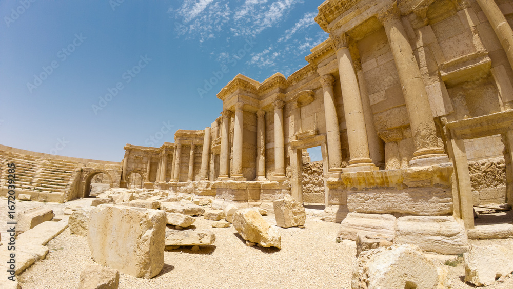 Fototapeta premium Ancient ruins with columns under a blue sky