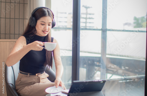 Free Download Smiling students study in a comfortable classroom with books and coffee, listening to music, and balancing their studies, inspiration, and well-being. - GFXLoad