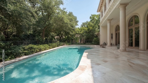 Expansive mansion backyard showcasing a pristine pool area surrounded by lush greenery
