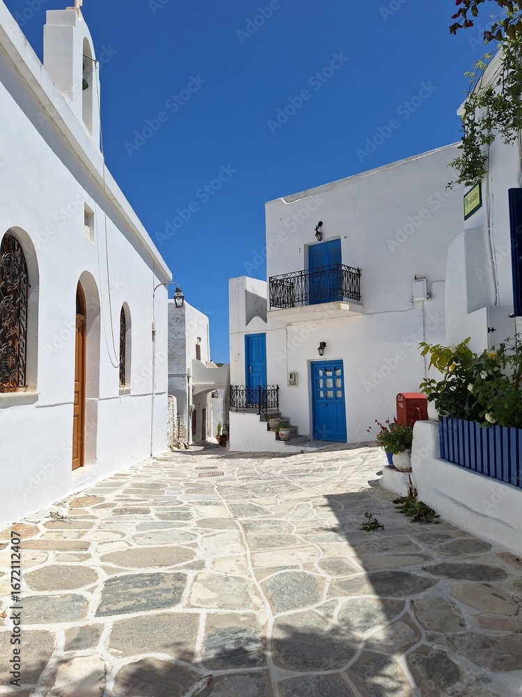 Naklejka premium White houses and blue doors in Lefkes on Paros, Greece