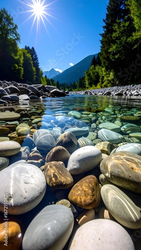 Crystal clear riverbed with colorful stones