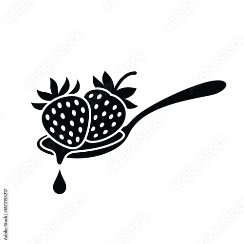 Black and white spoon with two strawberries and dripping juice
