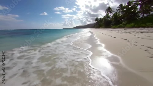 Wallpaper Mural Tropical beach with footprints on white sand and blue ocean waves Torontodigital.ca
