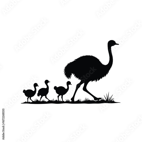 Black silhouette of an ostrich and chicks walking in grass