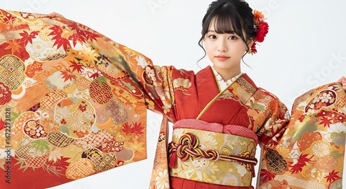 Elegant woman gracefully displays vibrant autumnal kimono soft light enhances rich colors. AI Generated