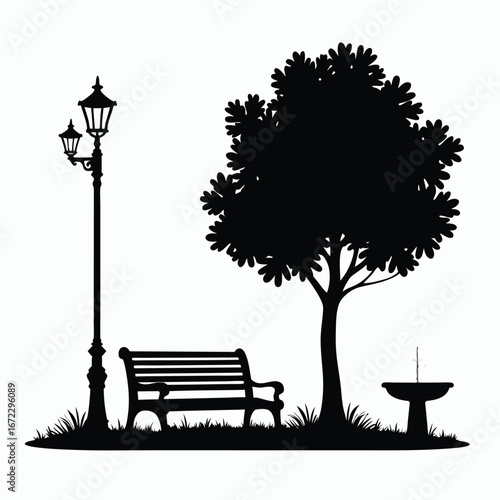 Black silhouette of park bench tree lamppost and fountain