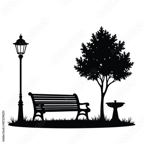 Black silhouette of park bench under tree with lamp post