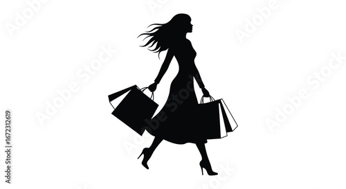 Silhouette of woman walking with shopping bags in hand
