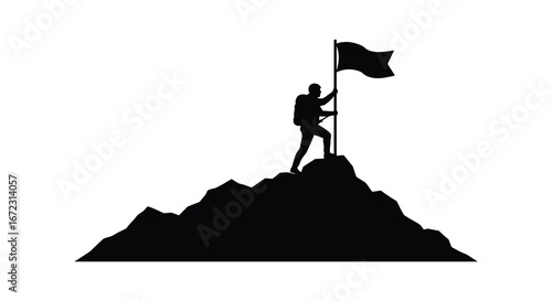 Man standing on mountain peak holding flag in victory