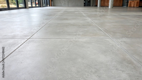 Polished concrete floor with expansion joints in a modern interior space architecture