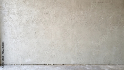 Textured concrete wall with a rough finish and a concrete floor unfinished construction