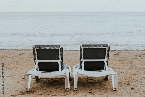 
Two hammocks on the beach at sunset.
Tourism, end of vacation, September, nostalgia