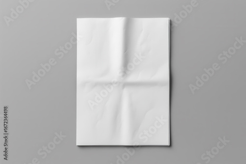 Folded newspaper mockup on gray background