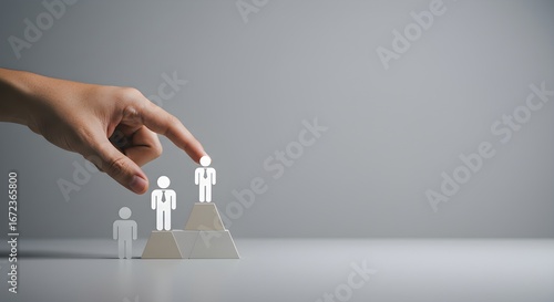 Gray, Minimalist Image Focuses on Hand Leading a Figure to Success. Good for Branding, Business Concepts, and Presentations.