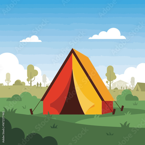 A colorful tent is set up in a grassy field with trees.