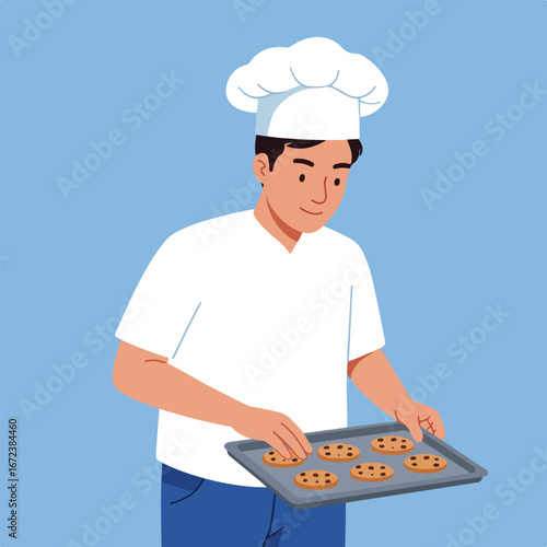 Chef Holding a Cookie Tray in the Kitchen