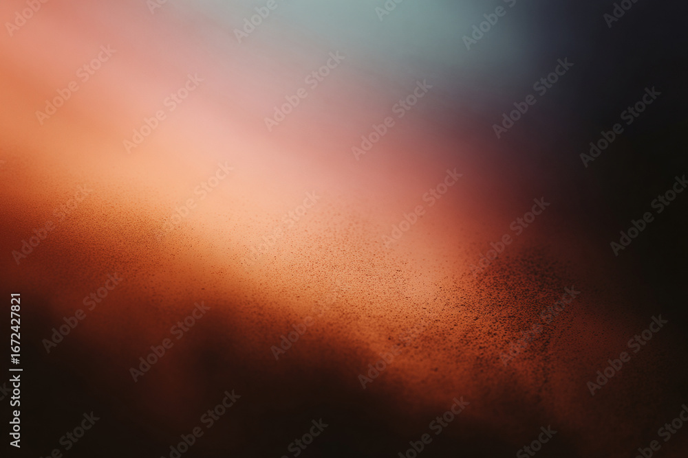 Fototapeta premium Blurry gradient with soft orange, red, and teal tones and grainy texture, creating an abstract atmospheric effect