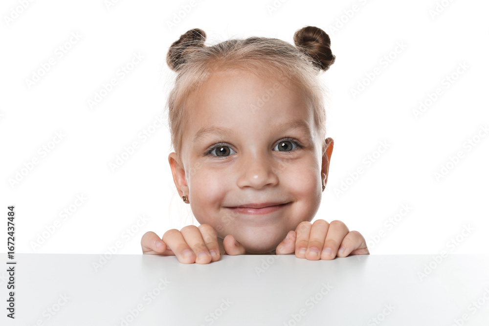 Curious little girl peeking over table against white background