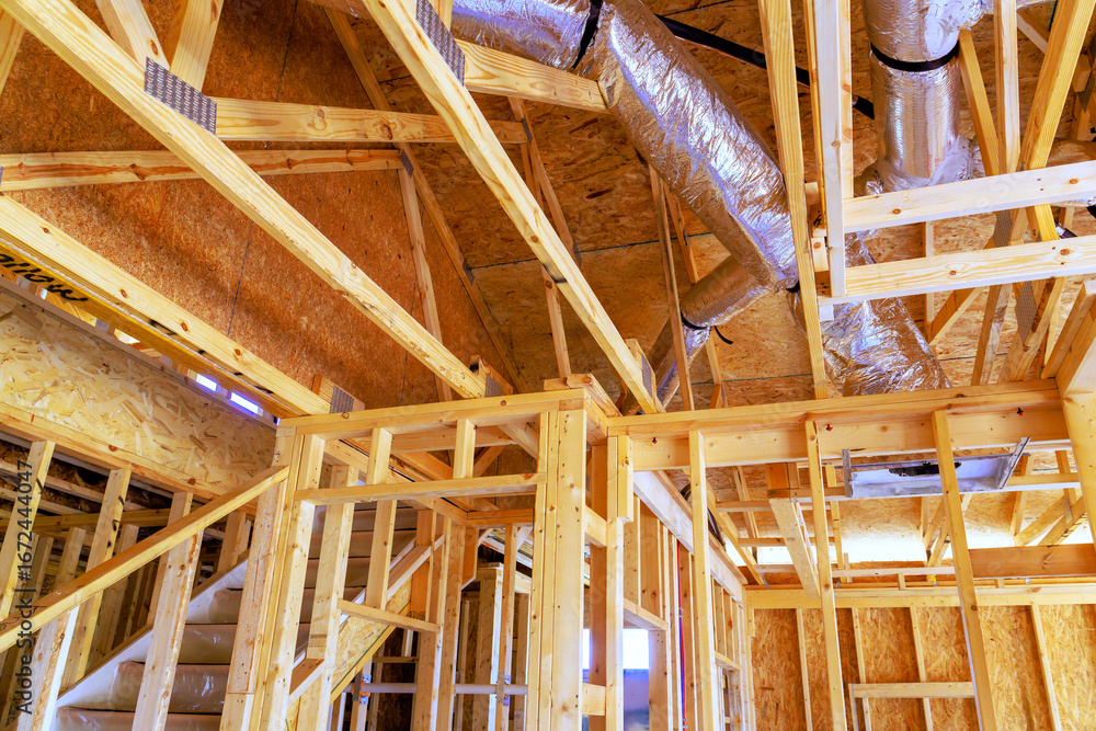 Construction site at wooden framing ductwork, showcasing progress of new residential building Construction site at wooden framing ductwork, showcasing progress of new residential building