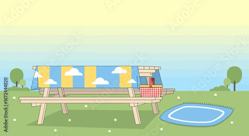 Cartoon Picnic Scene With Table Basket And Blanket On A Green Meadow