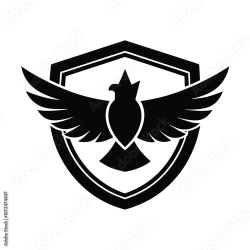 silhouette of a falcon face with spread wings