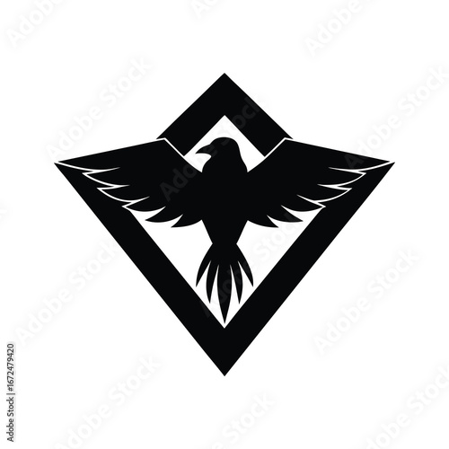 silhouette of a raven head with wings extended 