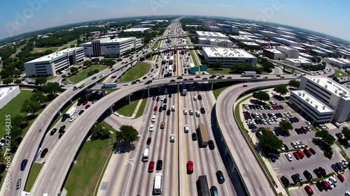Overhead Perspective of Vehicular Traffic Flow on Major Highway Passing by Commercial Office Complexes and Business Parks