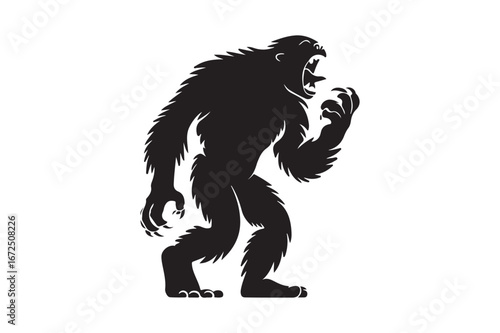 Silhouette of a hairy bigfoot creature standing and looking towards the viewer