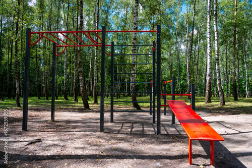 Gymnastic horizontal bars and parallel bars outside without people.