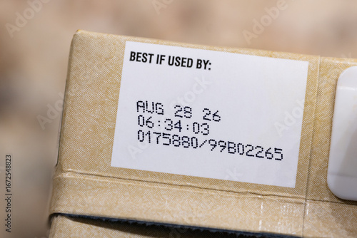 Close up text best before date on carton of broth