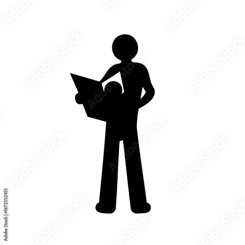 Silhouette of a person standing and reading or viewing a book closely
