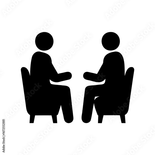 Two people sitting in chairs facing each other in conversation mode