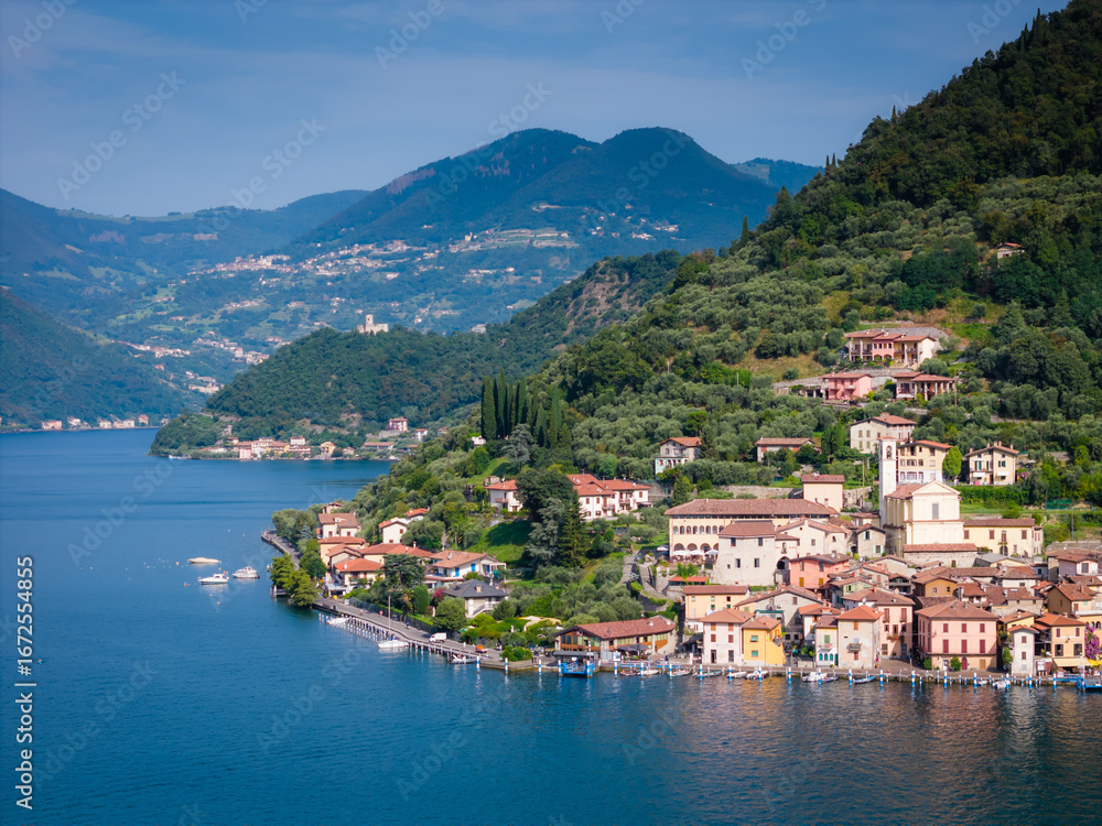 Obraz premium Peschiera Maraglio in Monte Isola, Lake Iseo or Lago d'Iseo. Beautiful island in Lombardy, Italy. Aerial drone view